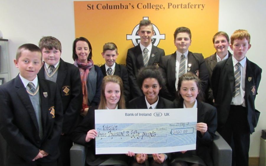 Pupils presenting Rosie Murray from Trocaire with a cheque for £3,050